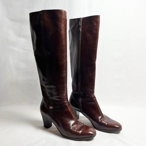 Brown leather knee high heeled boots